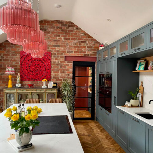 Pink Palermo chandelier handing over a kitchen island