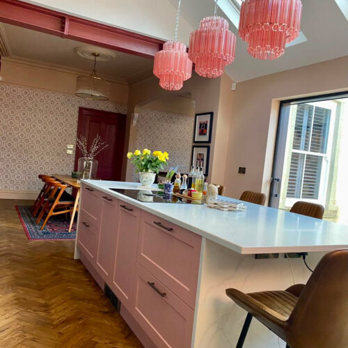 Pink Palermo chandelier handing over a kitchen island