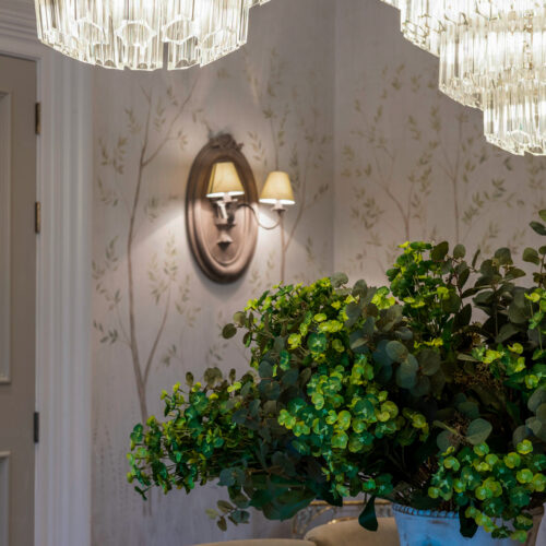 large clear glass chandelier in a tiered formation in a project by Tile House Studio interior designers