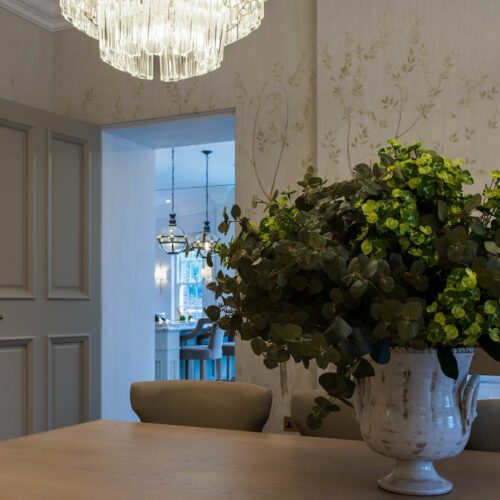 large clear tiered chandelier in a dining room of a Georgian renovation project