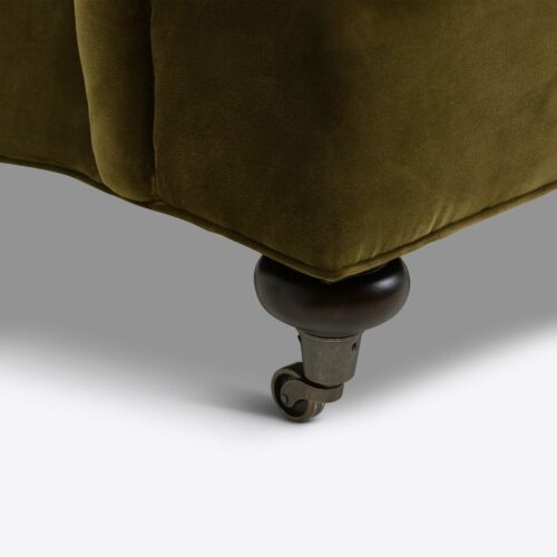 moss green velvet traditional armchair on castors