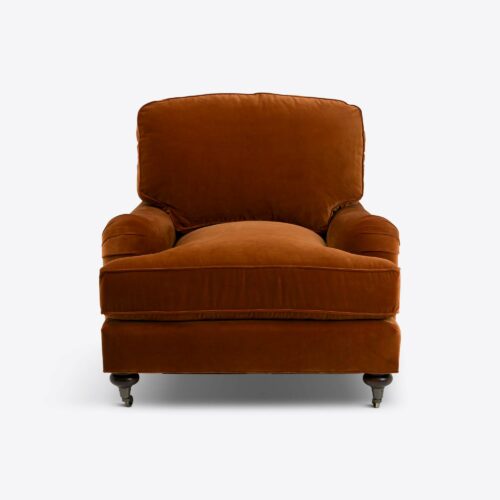 Rust velvet traditional armchair on castors