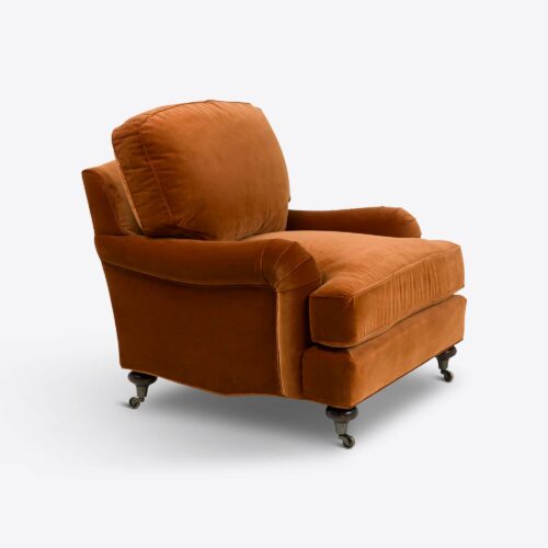 Rust velvet traditional armchair on castors