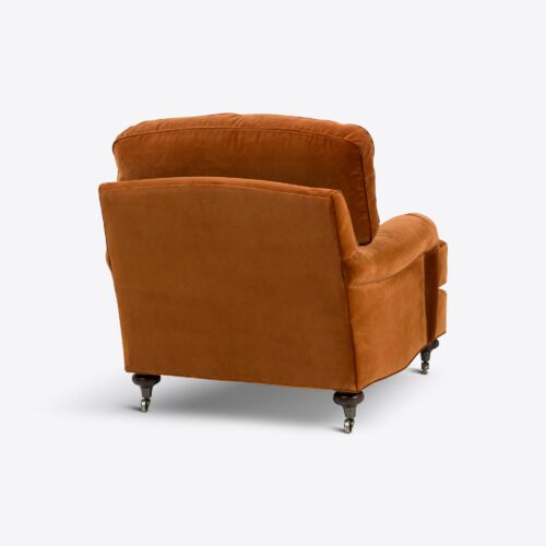 Rust velvet traditional armchair on castors