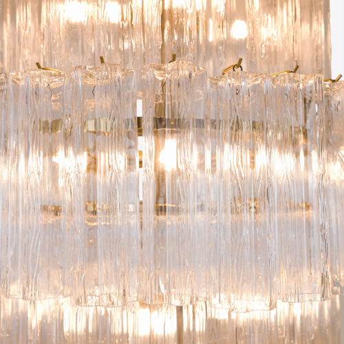 tiered stairwell chandelier made of clear glass tubes