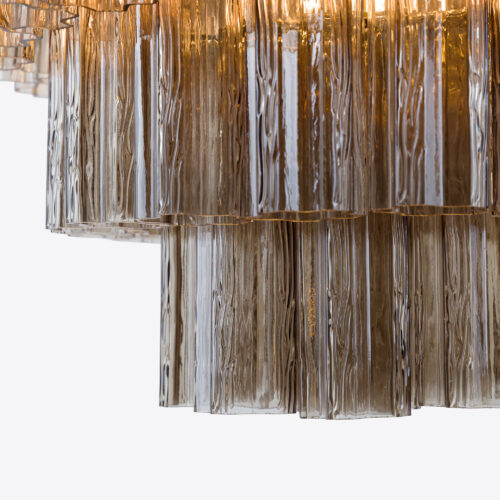 Treviso mid-century inspired tiered glass chandelier in clear smoked quartz or pink glass